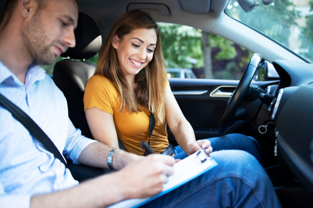car instructor explaining city traffic rules before driving car e1694066233214 1024x682